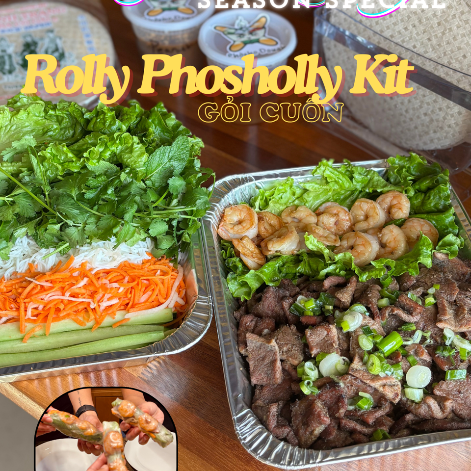 A "Rolly Phosholly Kit" with separate trays of shrimp, beef, lettuce, herbs, noodles, carrots, and cucumbers.